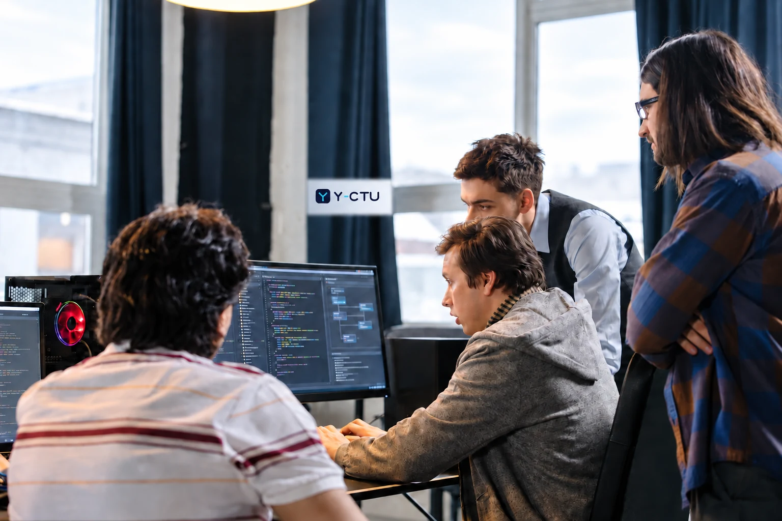 Software development team reviewing application code and architecture together